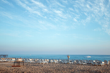 Beautiful beach, sea view. This morning on an empty beach, holidays by the sea, vacation time.