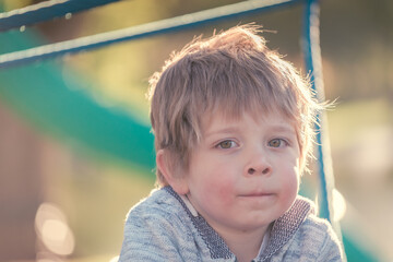 Close-up portrait of the boy on the playground in South Australia on a bright sunny day