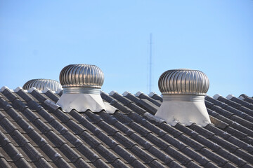 Air ventilator on the roof of factory with blue sky