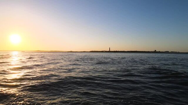 Pull back shot during sunset at New Smyrna Beach and Ponce Inlet, Florida.