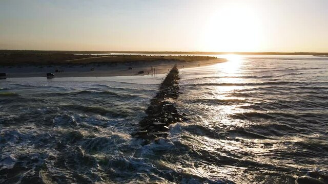 Orbit shot of New Smyrna Beach jetty during sunset. Shark Capital of the World.