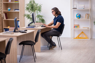 Young male student in tele-education concept