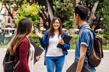young mexican woman in group of Latin students in university in Latin America
