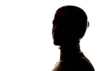 Fototapeta premium Dark silhouette of a woman on white background close-up.
