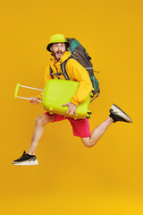 joyful traveler with baggage