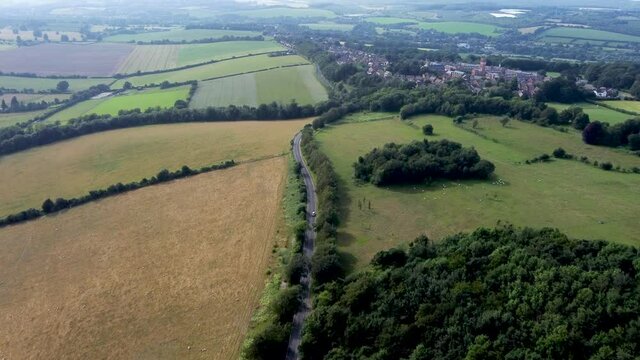 4K drone footage flying high over a country road in Kent, UK.