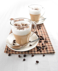 hot cafe coffee latte with bubble layer and coffee bean on white background halal beverage menu