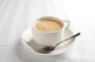 a cup of hot cafe coffee with fresh milk on white background halal beverage menu