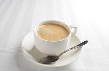 a cup of hot cafe coffee with fresh milk on white background halal beverage menu