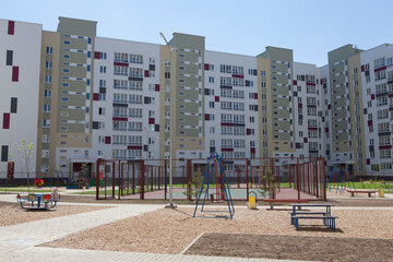 Fototapeta na wymiar Sports, playground, recreation area in the courtyard of a multi-storey new building.