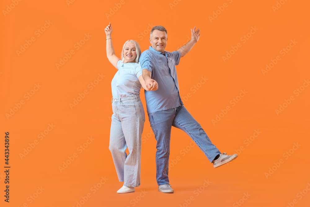 Canvas Prints Dancing mature couple on color background