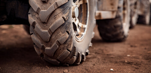 ATV wheels quad bike on forest offroad. Concept banner motocross quadricycle trip background © Parilov
