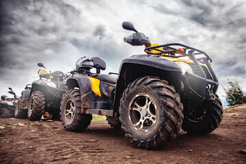 ATV quad bike on forest offroad, front view. Concept motocross quadricycle summer travel - obrazy, fototapety, plakaty