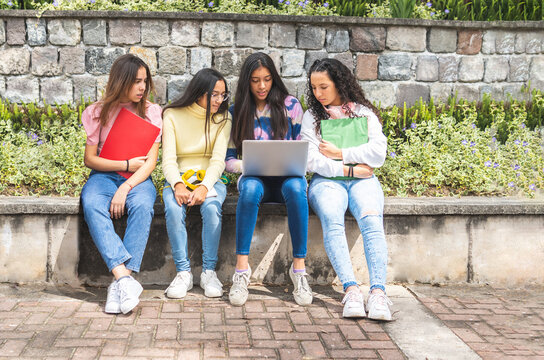 Group Of Latina Teen Student Girls Working On A Laptop