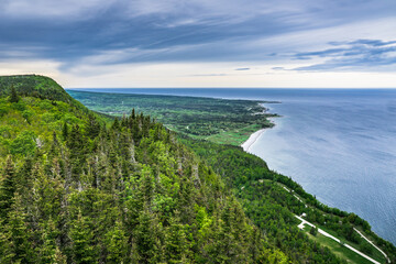 Fototapeta premium View on the mountains of Forillon National Park and in the far the Cap des Rosiers from the Mount St Alban hike belvedere (Quebec, Canada)