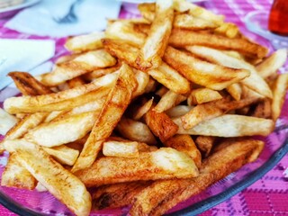 Fried potatoes. French fries on the breakfast plate.