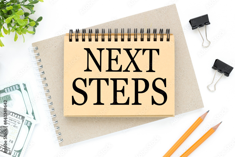 Poster next steps. text on white notepad paper. on a white photo with torn paper