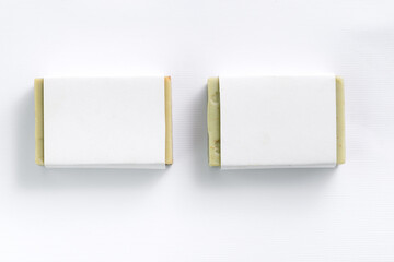 Hand made olive soap bars on white background, top view. Mockup for design - obrazy, fototapety, plakaty