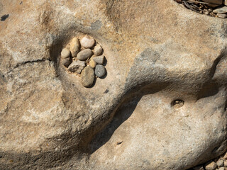 Fototapeta na wymiar small stones within a rock