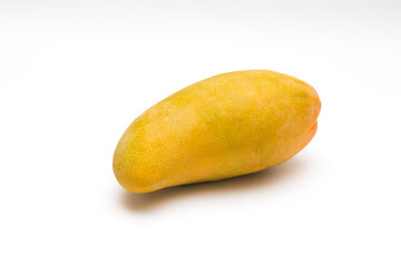 Top view for fruit is one yellow mango on white background with shadow and copy space for add...