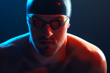 Male swimmer posing. Swimming concept photo.