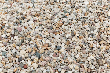 Pebble texture. A large pile of stones. Background. Space for text.