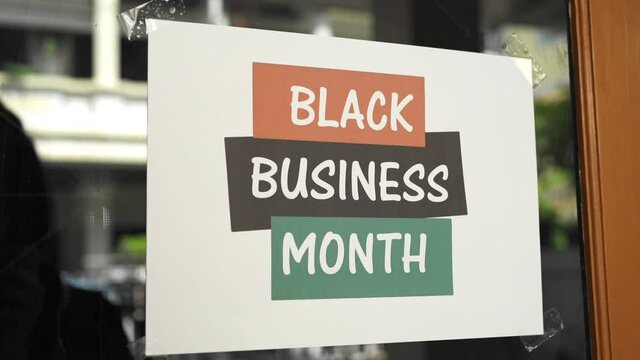 Black business month sign were attached on the window