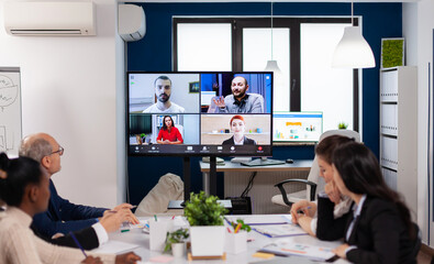 Team working by group video call share ideas brainstorming negotiating use video conference....