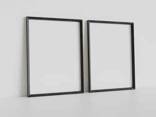 Two black frames leaning on white floor in interior mockup. Template of pictures framed on a wall 3D rendering