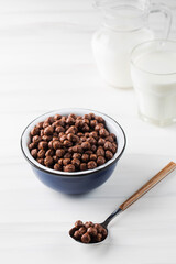 Round cocoa flakes in a bowl. Dry breakfast.
