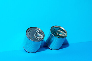 Tin can with food on blue background