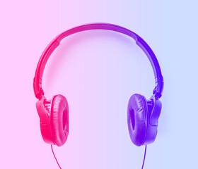 Headphones on a pink to blue gradient background