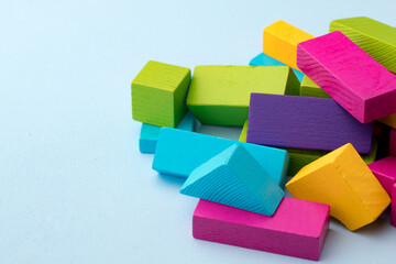 Wooden toy building kit details on blue background