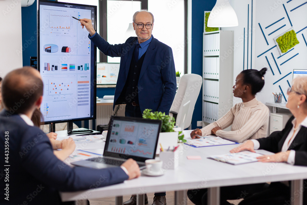 Poster experienced project leader analysing financial presentation during business conference in brainstorm