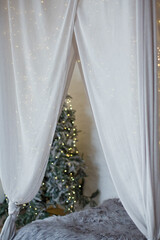 Christmas bedroom canopy with lights © aprilante