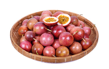 Passion fruit in wicker basket isolated on white