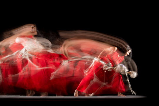 Digital Composite Image Of Women Dancing Against Black Background