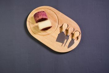 berry cheese suluguni  on wooden board grey background