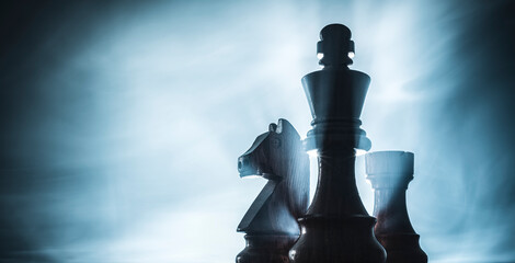 Chess game pieces and smoke