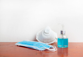 mask with alcohol sanitize jell bottle to protect coronavirus.