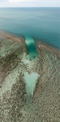 Heart Shape in the Ocean from Coral Reefs with a Deep Blue Sea Horizon Copy Space No People
