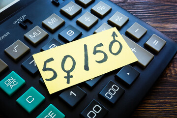Equal pay for equal work concept. Calculator and numbers 50.