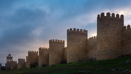 Fototapeta na wymiar Medieval city wall built in the Romanesque style, Avila in Spain