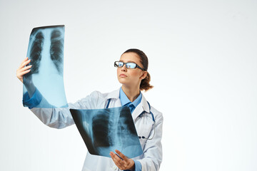 pretty woman in white coat x-ray diagnostics examination