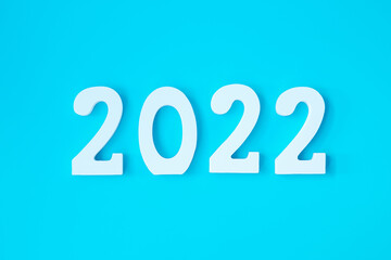 2022 white text number on blue background. Resolution, plan, review, goal, start and New Year holiday concepts