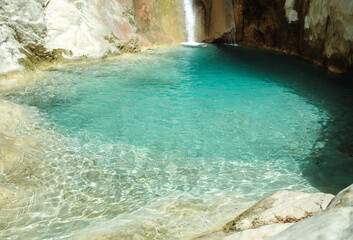 View at beautiful natural pool with emerald water.