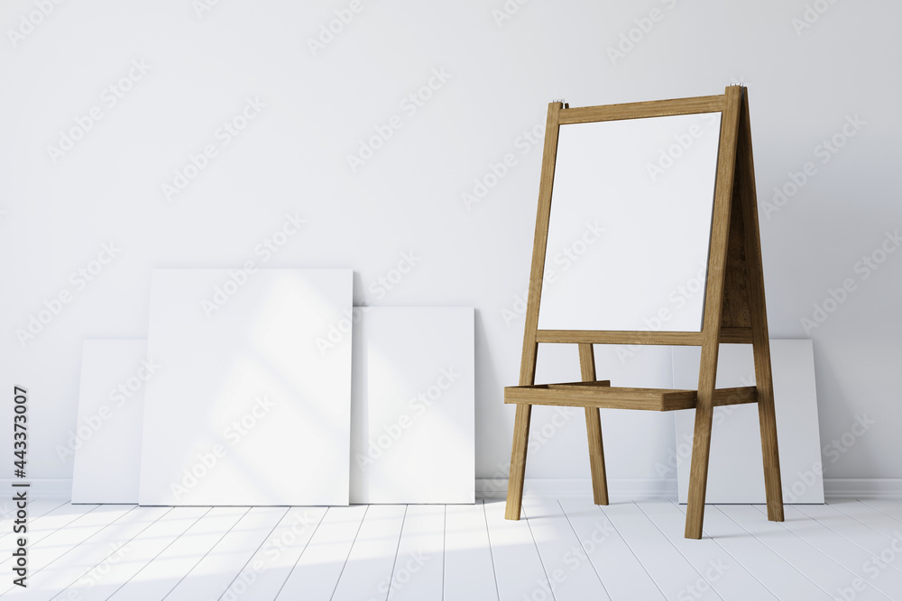 Poster wooden easel standing in an empty white room. 3d rendering