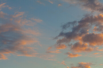 Low flying cumulus clouds at sunset