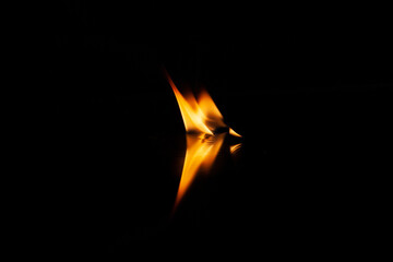 fire flame with reflection in the glass on a black background