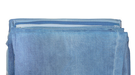 Jeans of various fabrics lie in a pile on a white background, isolate